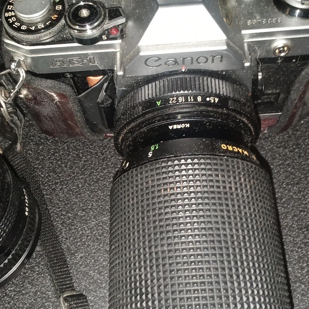 Canon AE1 Black and Silver SLR Camera with Pentax Flash and zoom lens